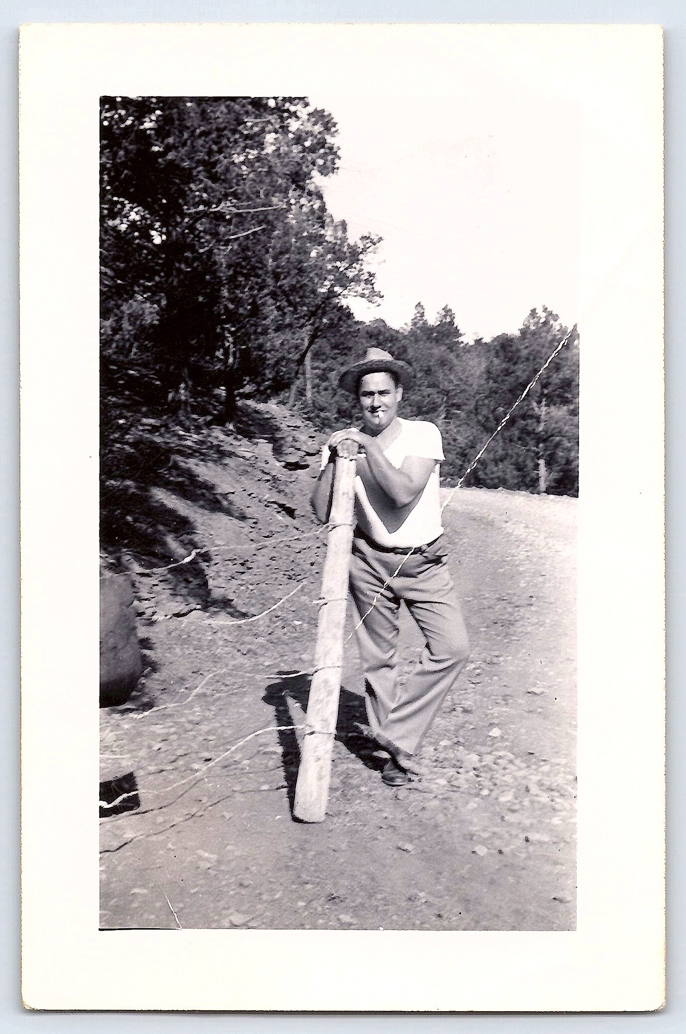 Man Leaning on Fence Post, Gelatin Silver Print, 3.21" × 4.96", 1950s - Front