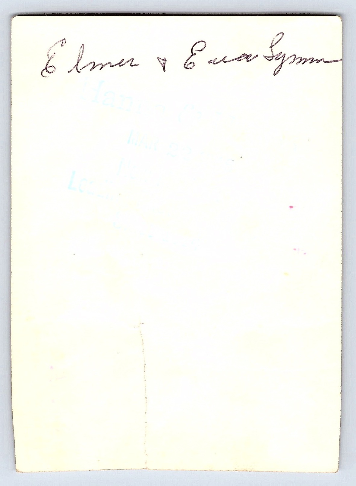 Couple by Brick Wall, Black and White Photograph, 2.7 × 3.77 inches, 1950s - Back